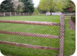 Locust hemlock split rail with chain link fabric wood fence