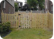 Scallped picket wood fence