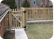 Wood picket fence with steel posts